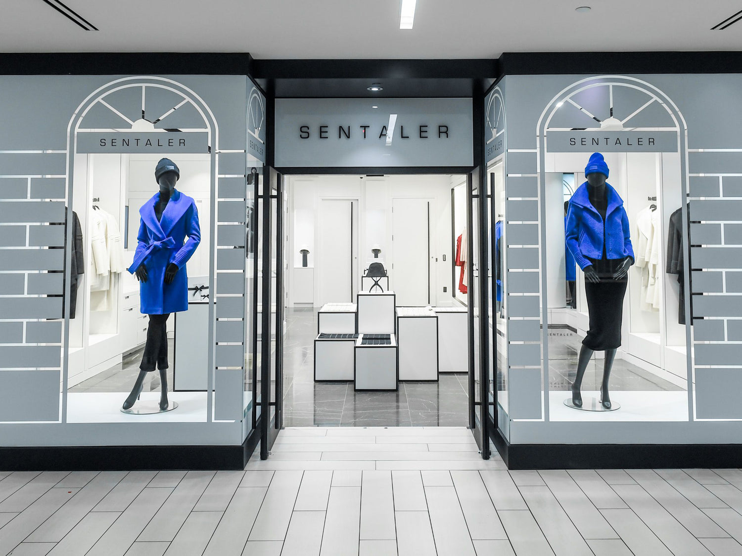 Image of the front of the SENTALER Flagship store with mannequins in the window.