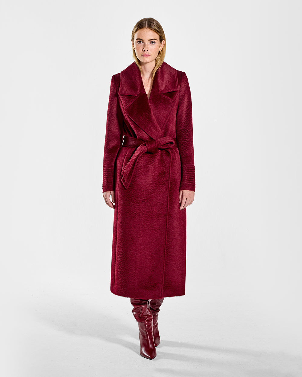 Sentaler Suri Alpaca Long Notched Collar Wrap Bordeaux Coat in Suri Alpaca wool. Seen from front belted on female model.