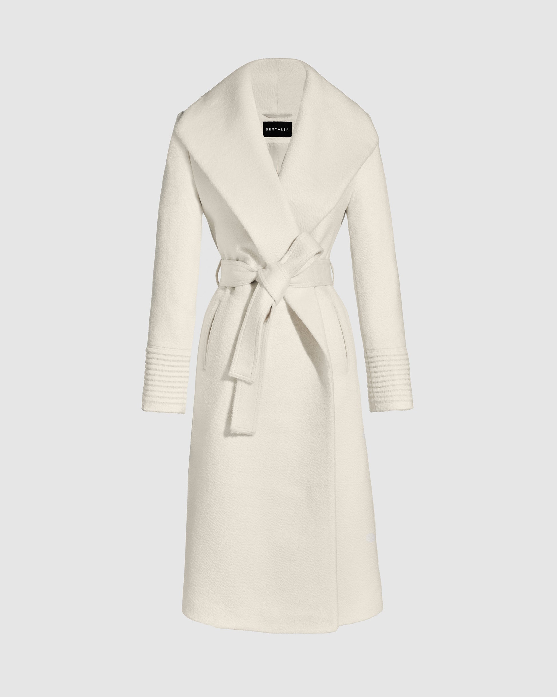 Sentaler long ivory wrap coat made of suri alpaca wool with a shawl collar, belted.