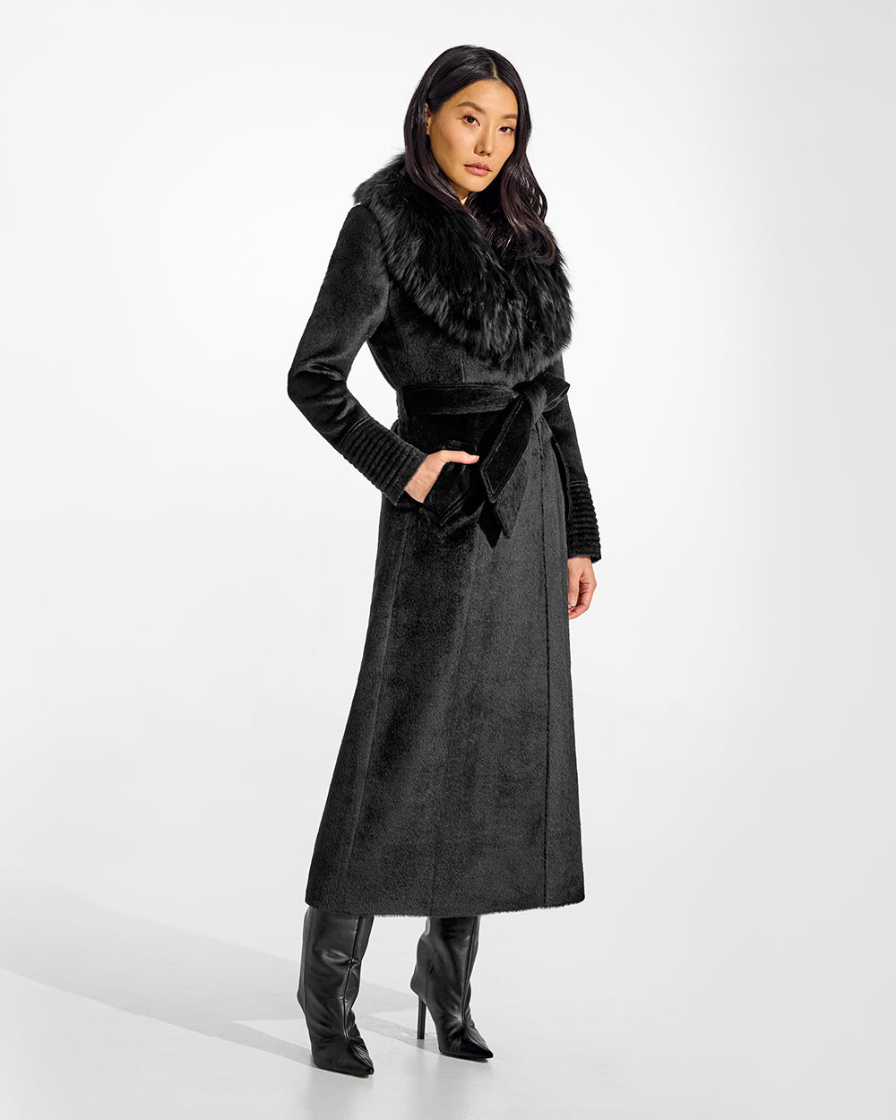 Sentaler Suri Alpaca Maxi Black Coat with Fur Collar in Suri Alpaca wool. Seen from side belted on female model.