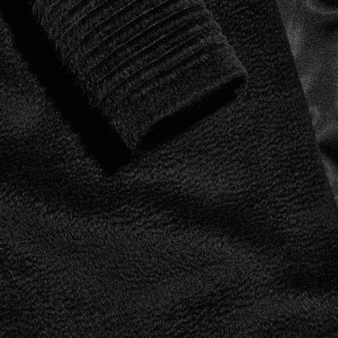 Sentaler Suri Alpaca Long Shawl Collar Wrap Black Coat with Ribbed Sleeves fabric swatch close up.