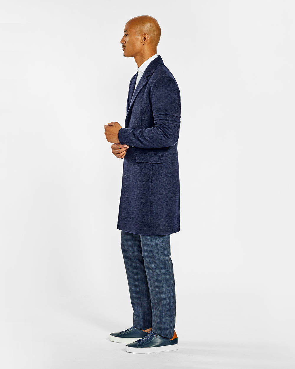 Sentaler Baby Alpaca Notched Lapel Deep Navy Overcoat in Technical Baby Alpaca wool. Seen from side on male model.