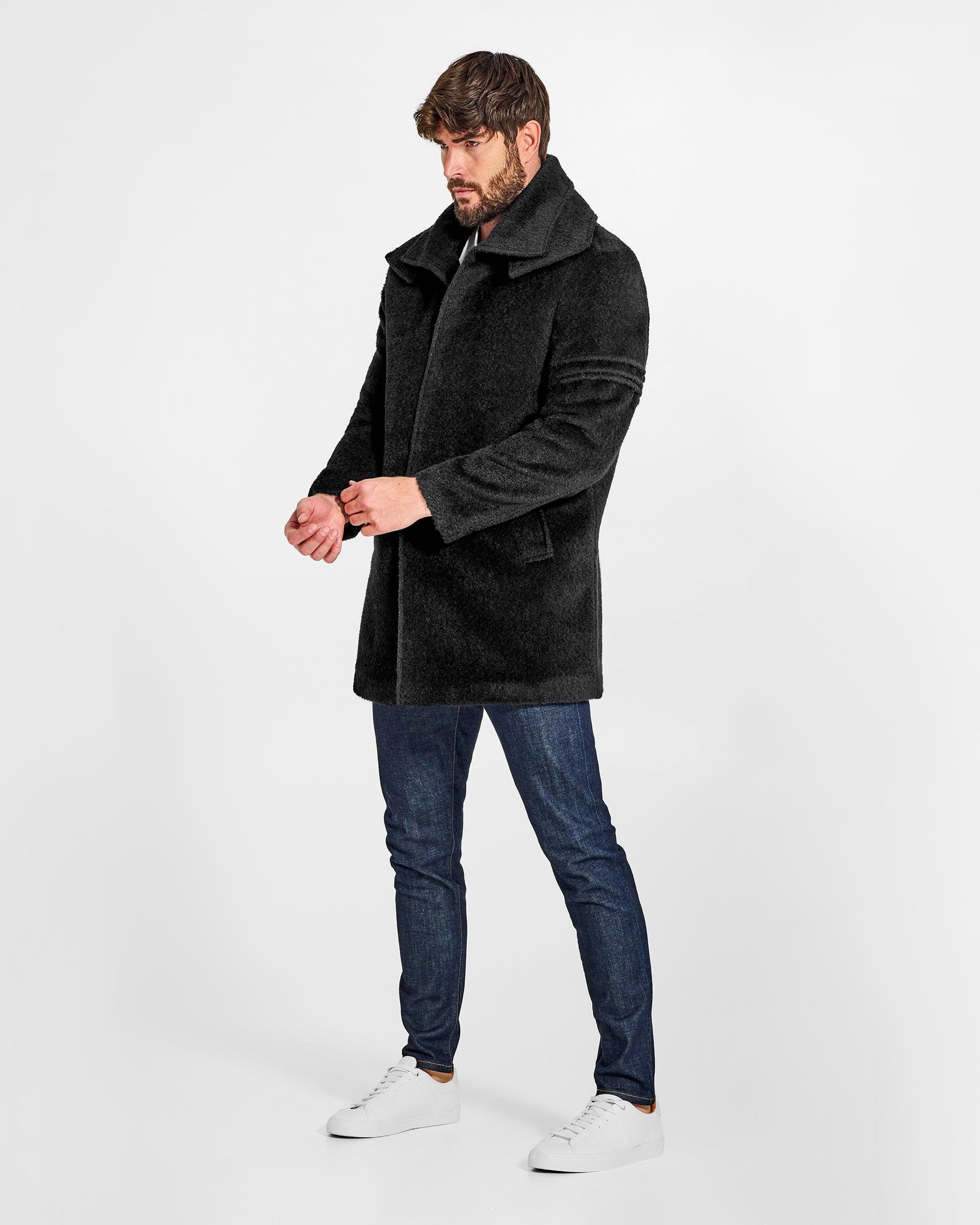 Sentaler Double Collar Black Topcoat in Bouclé Alpaca wool. Seen from side on male model, worn buttoned.