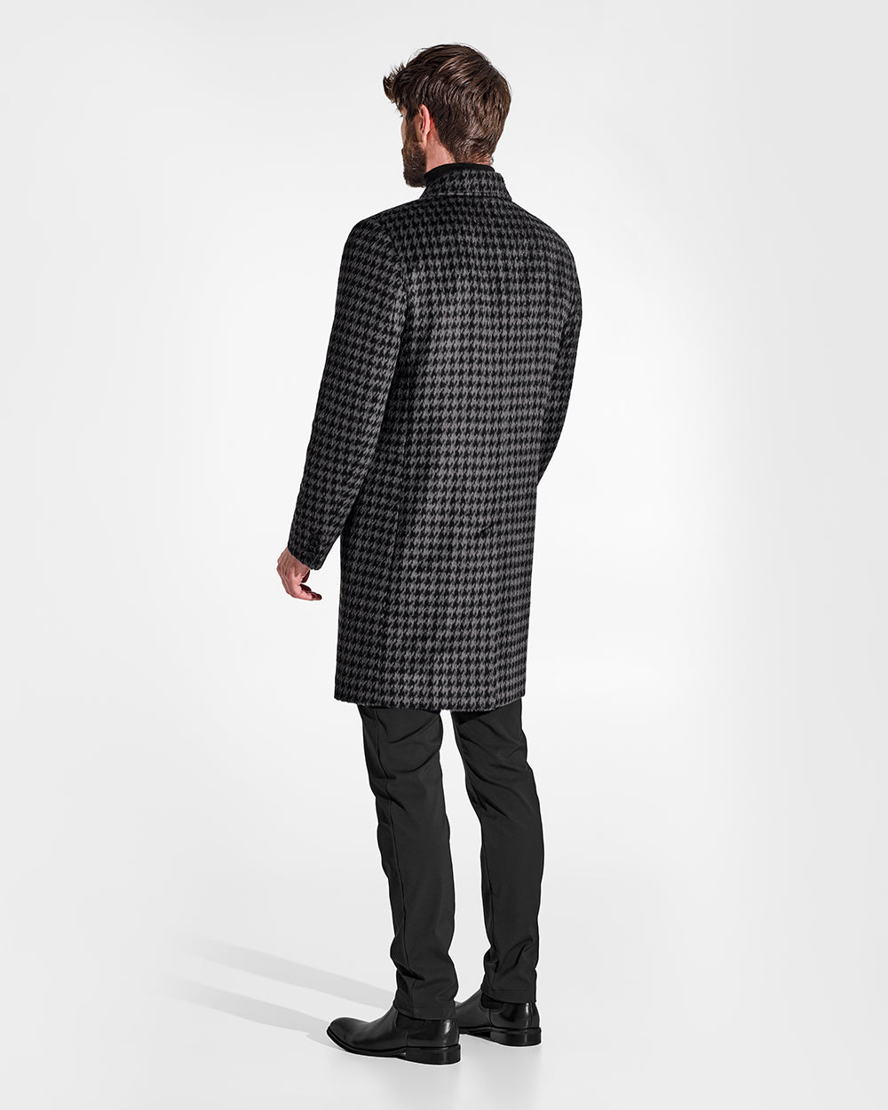 Sentaler Suri Alpaca Notched Lapel Black & Graphite Houndstooth Overcoat in Technical Suri Alpaca wool. Seen from back on male model.