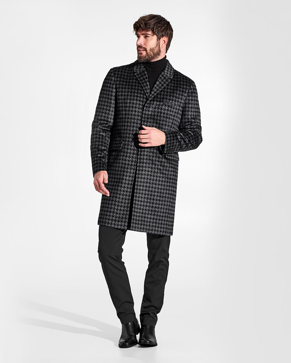 Sentaler Suri Alpaca Notched Lapel Black & Graphite Houndstooth Overcoat in Technical Suri Alpaca wool. Seen from front on male model.