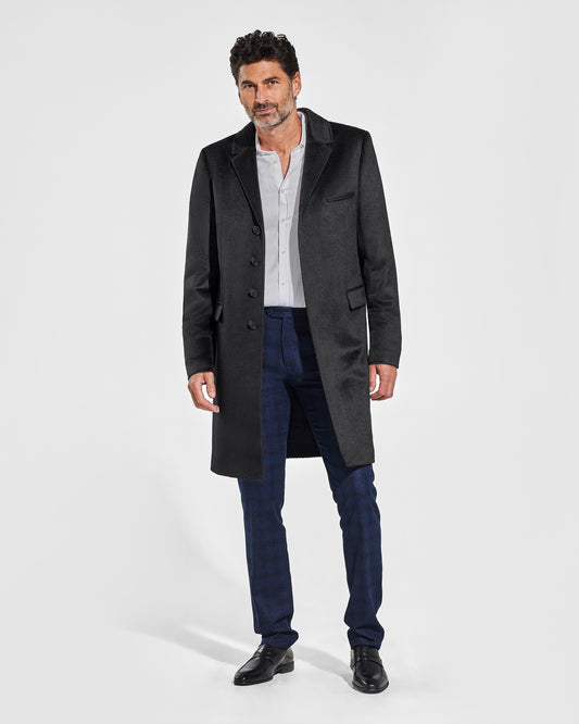 Sentaler Notched Lapel Black Overcoat in Suri Alpaca wool.. Seen from front on male model, worn open.