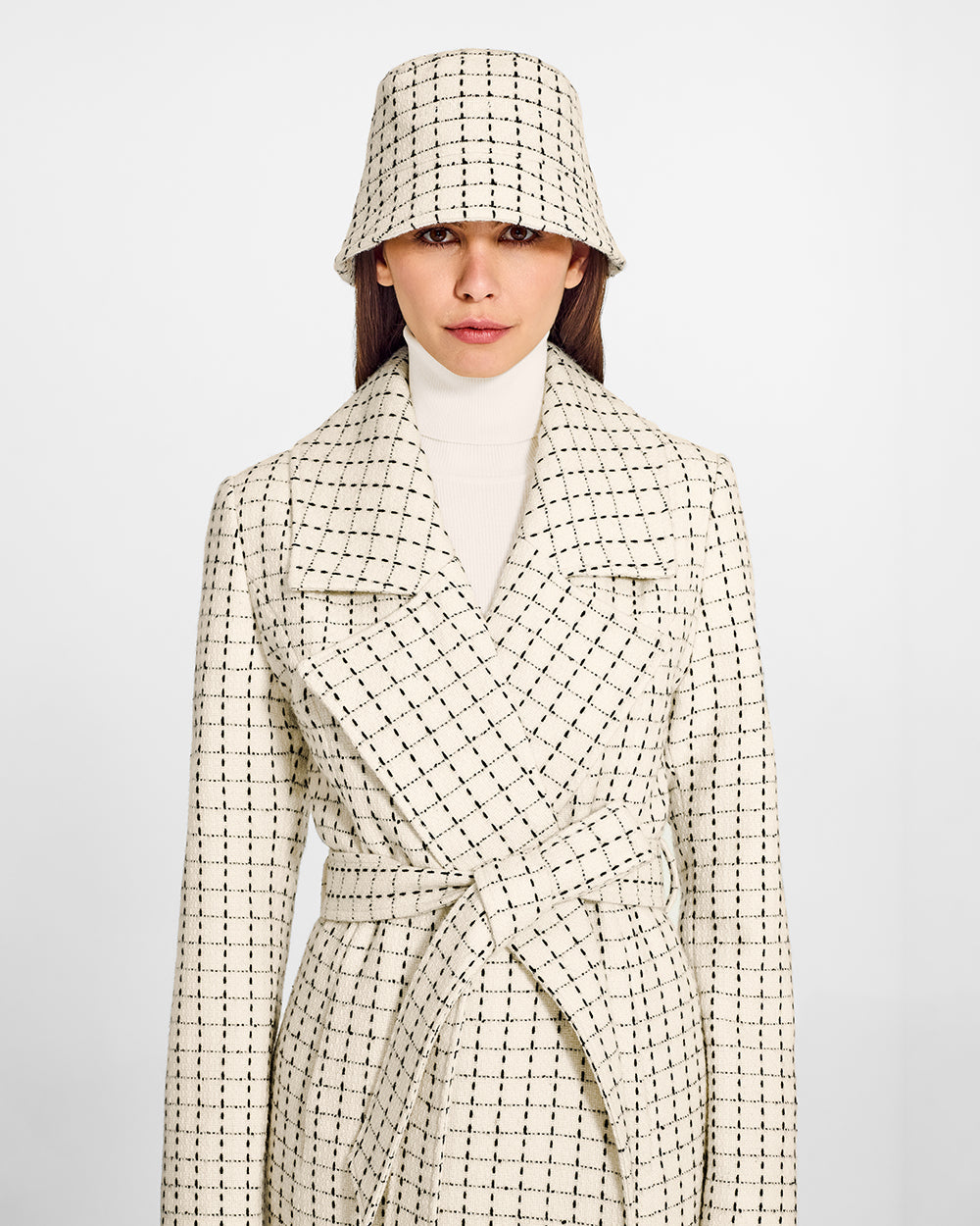 Sentaler Tweed Ivory Check Bucket Hat in Tweed Baby Alpaca wool. Seen from front close up on female model.