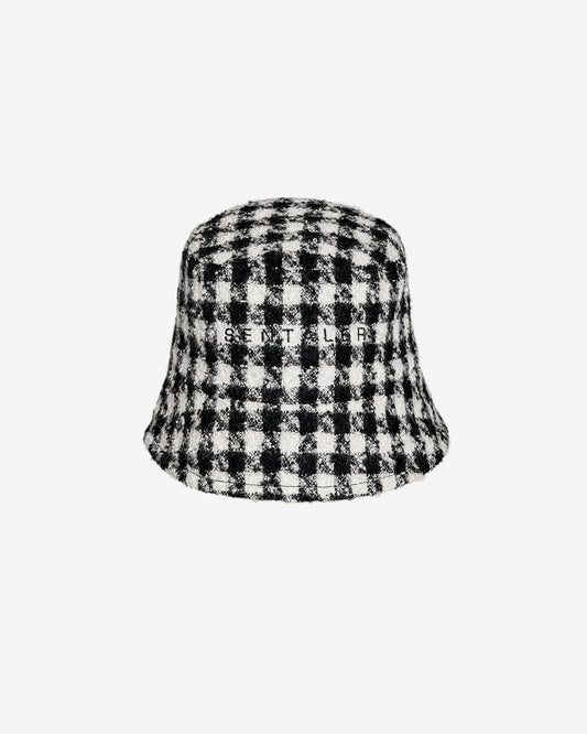 Sentaler Tweed Black and White Houndstooth Bucket Hat in Tweed Suri Alpaca wool. Seen as off figure.