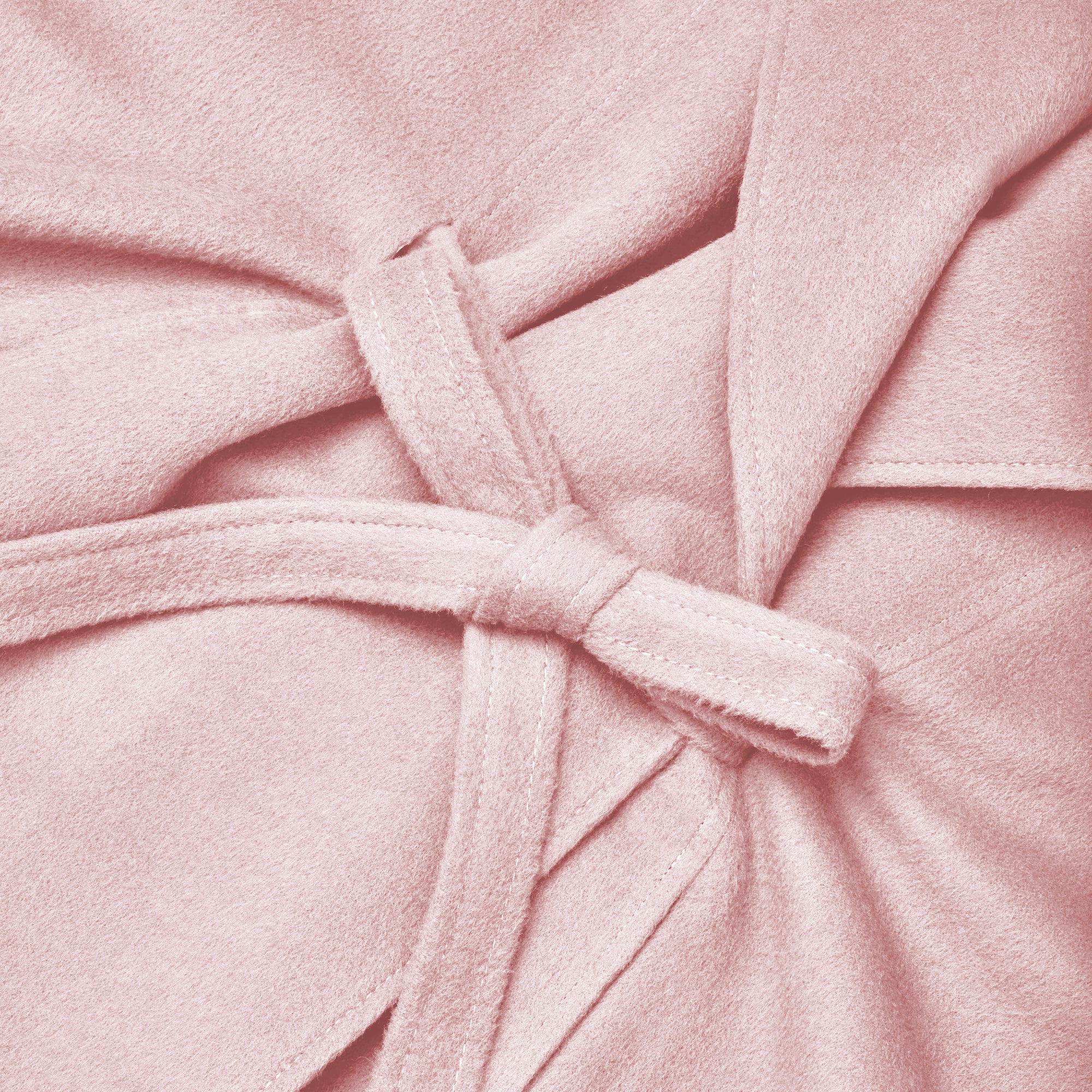 Close-up of pink frost baby alpaca cape.