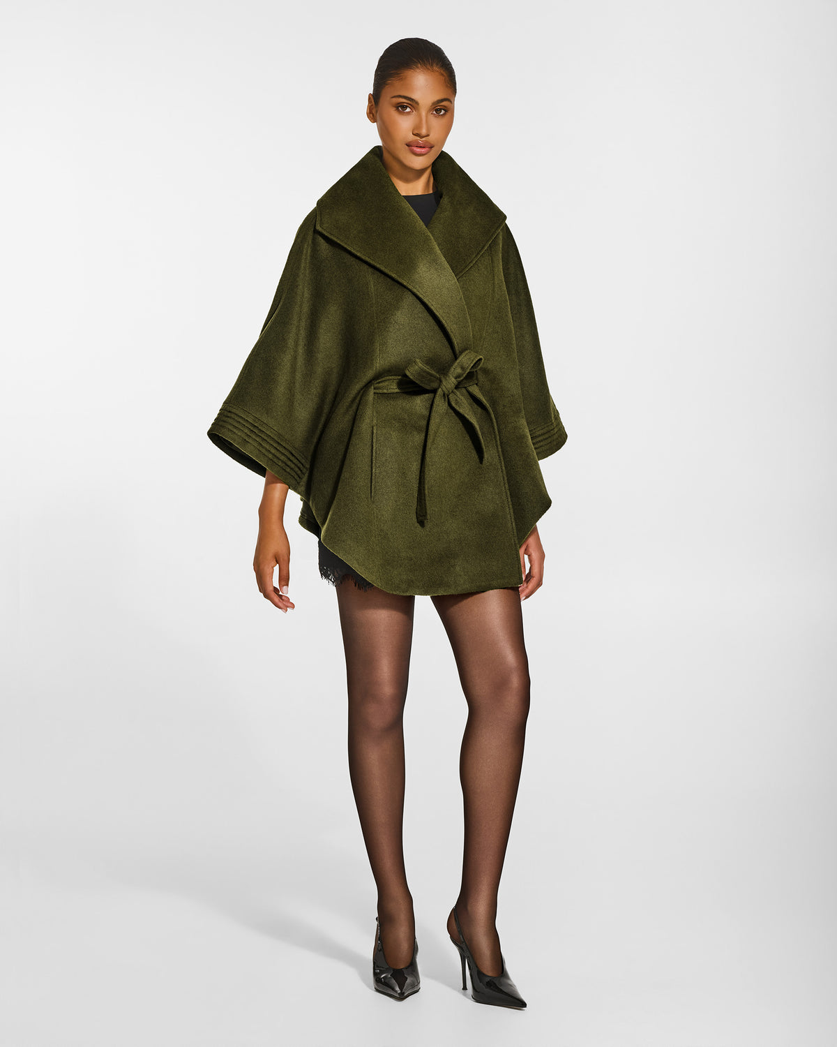 SENTALER Cape with Shawl Collar and Belt in Olive Green, Baby Alpaca. Worn by a female model, side view, belted.