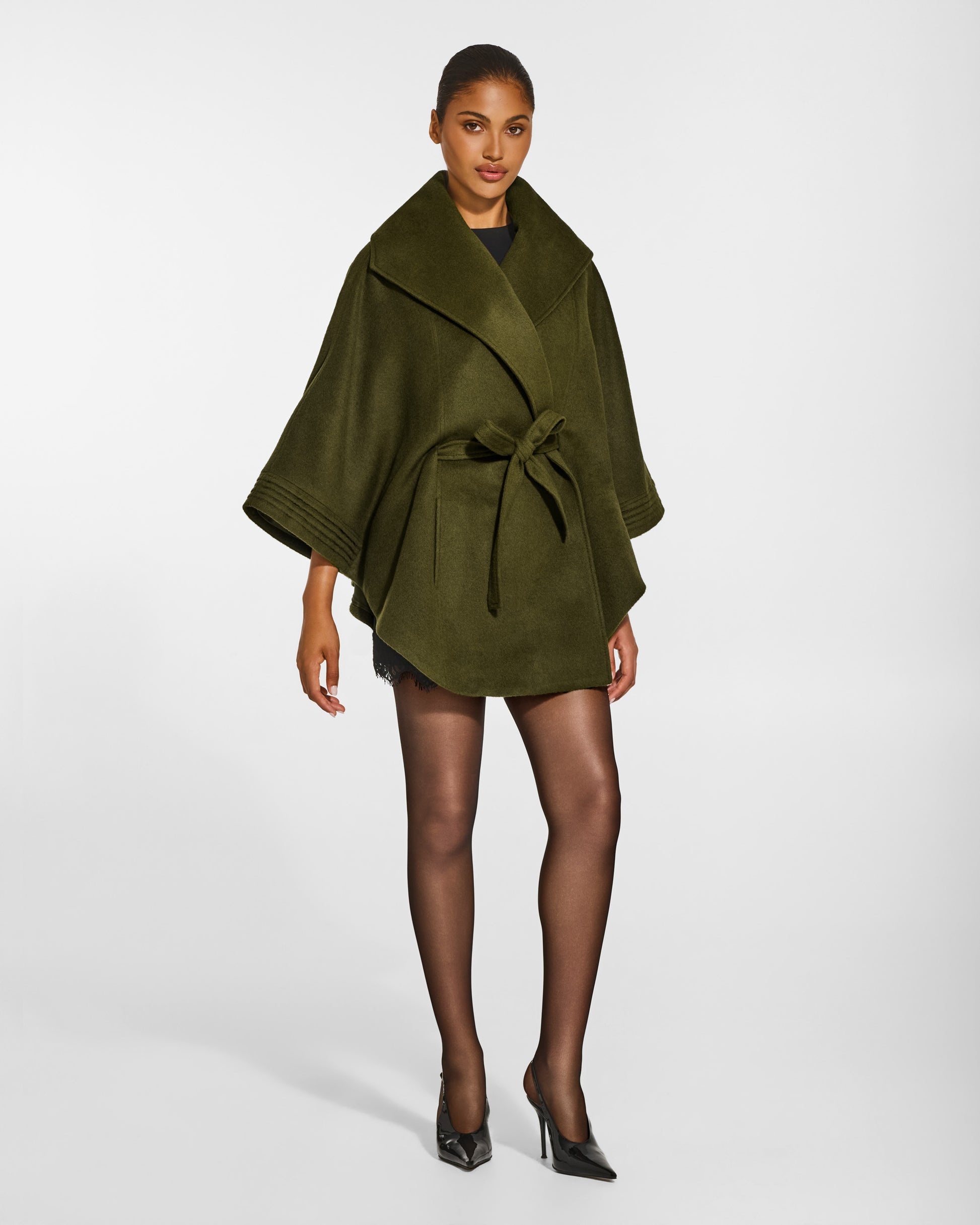 SENTALER Cape with Shawl Collar and Belt in Olive, Baby Alpaca. Worn by a female model, side view, belted.