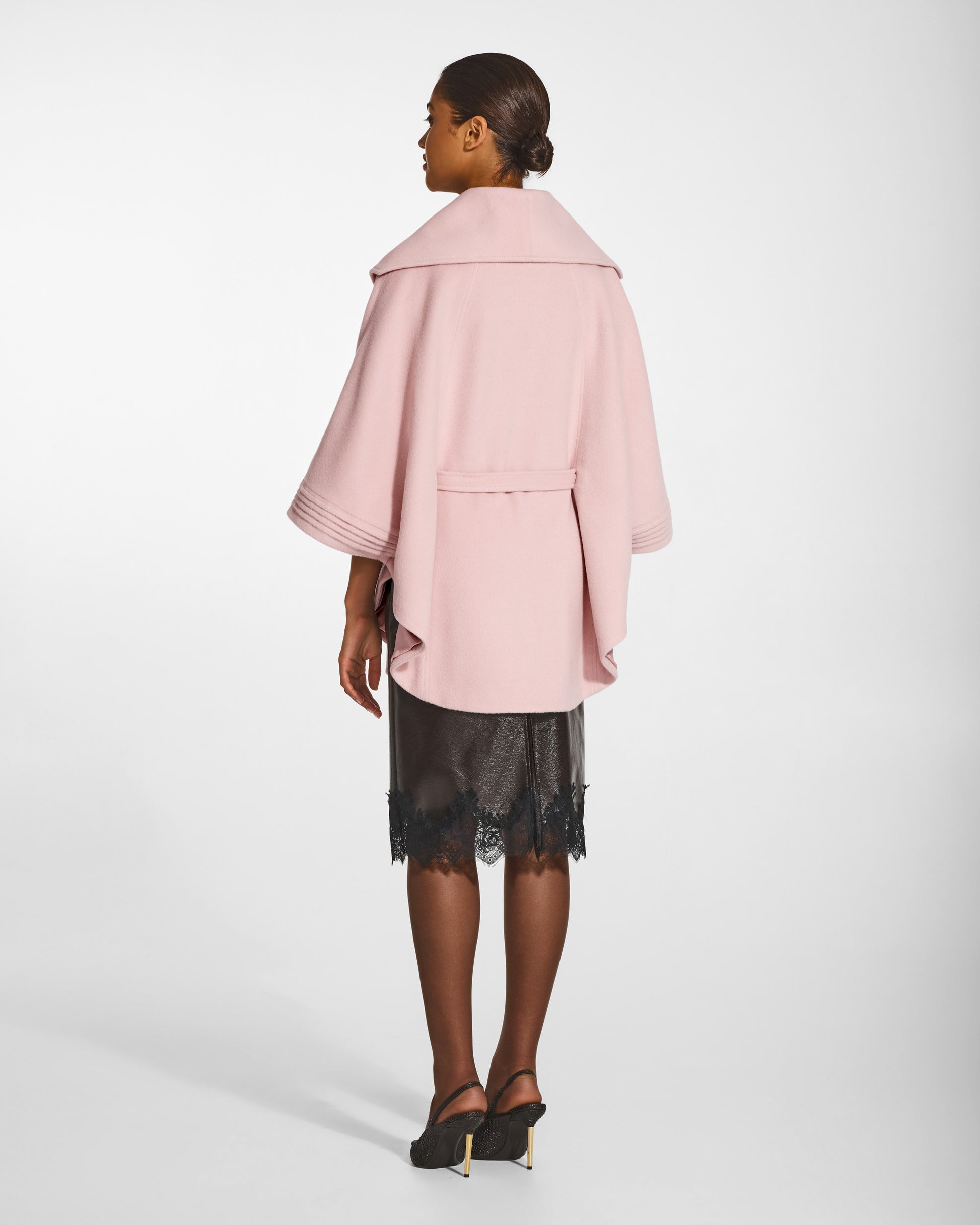 SENTALER Cape with Shawl Collar and Belt in Pink Frost, Baby Alpaca. Worn by a female model, back view, belted.