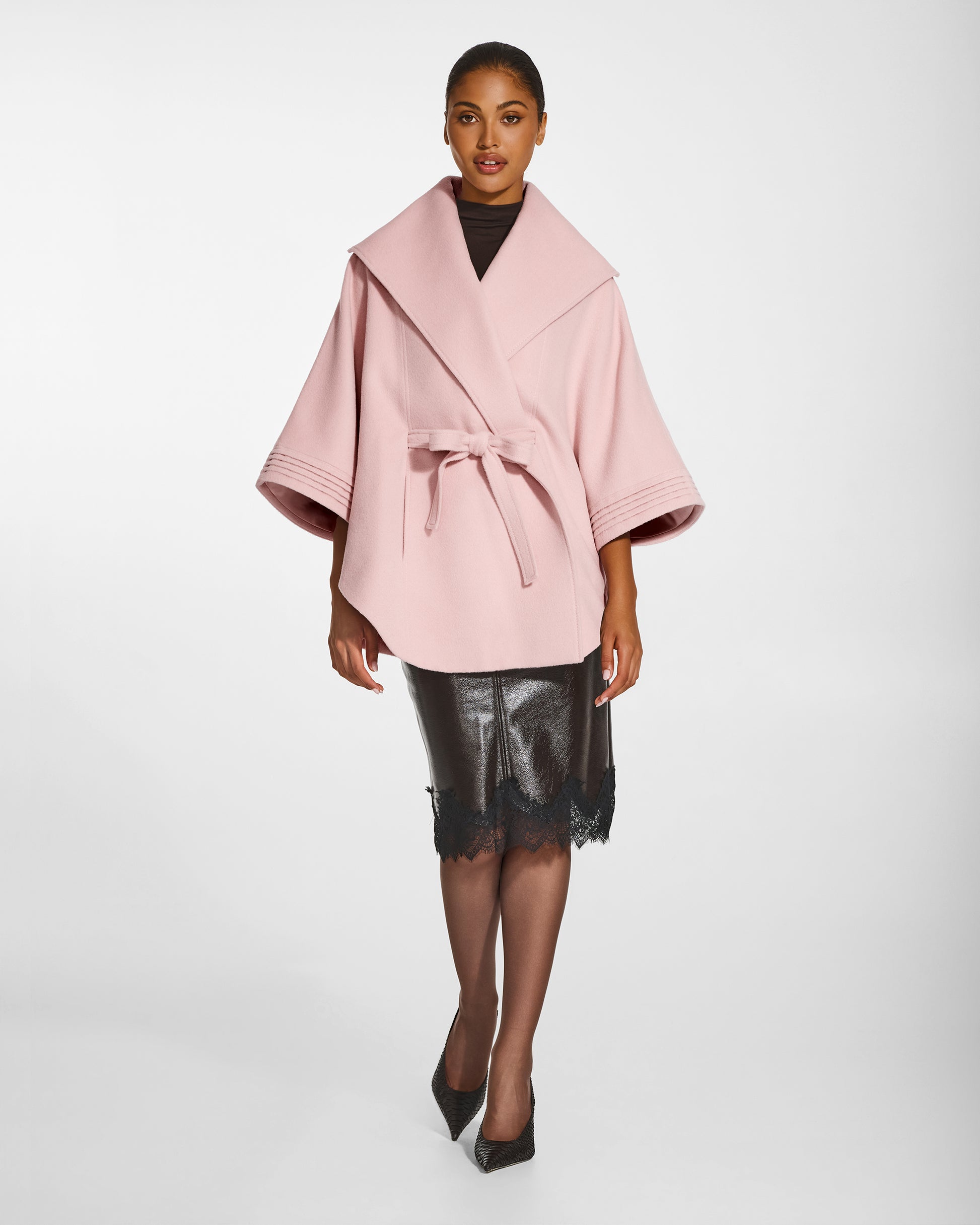SENTALER Cape with Shawl Collar and Belt in Pink Frost, Baby Alpaca. Worn by a female model, front view, belted.