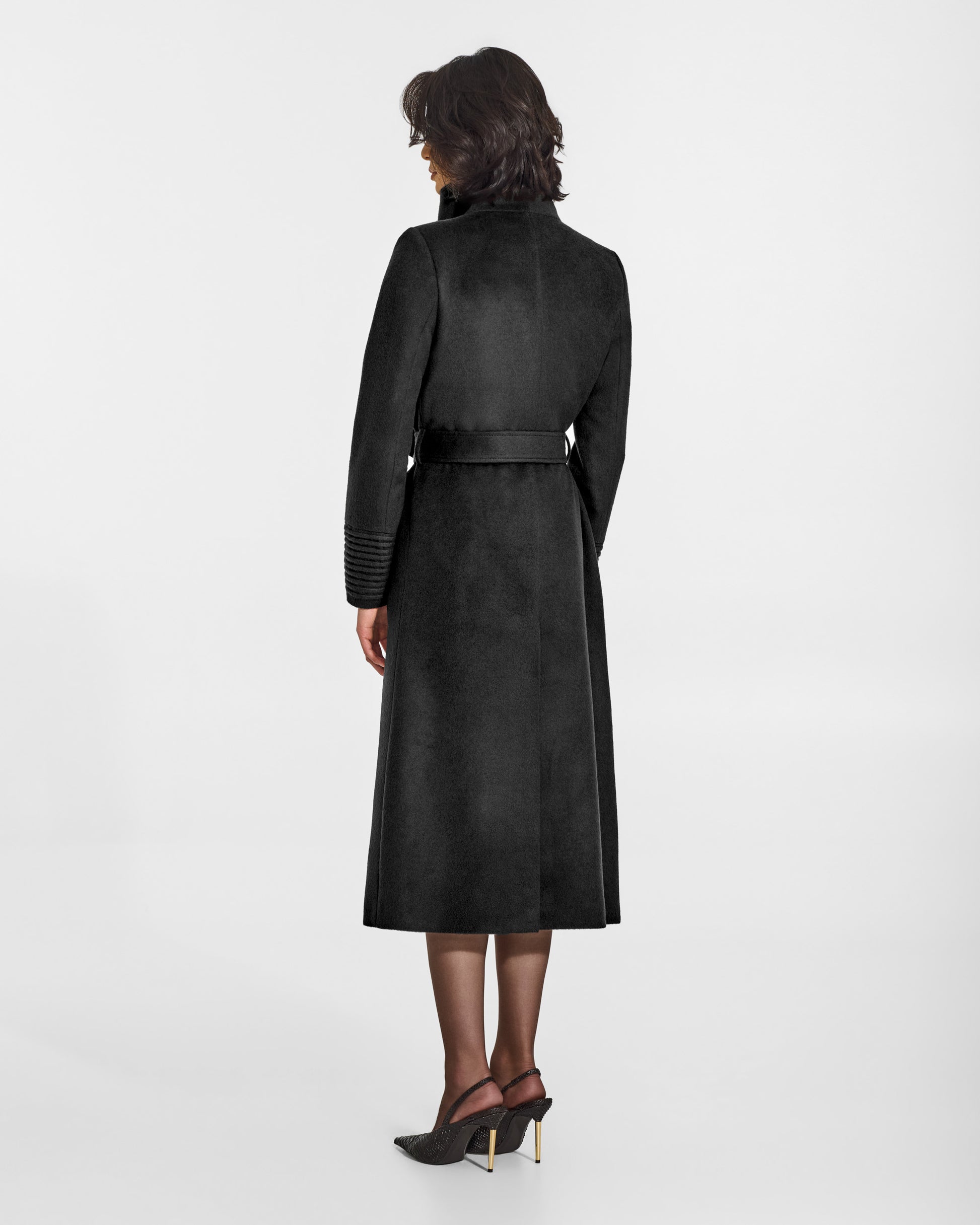 SENTALER Long Funnel Collar Wrap Coat in Black, Baby Alpaca. Worn by a female model, back view, belted.