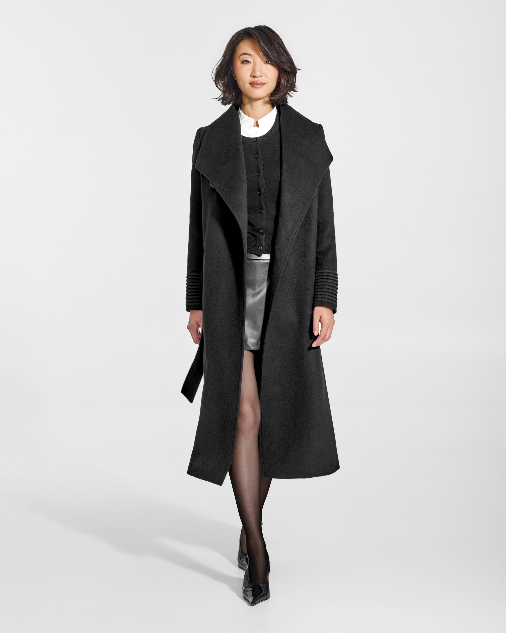 SENTALER Long Funnel Collar Wrap Coat in Black, Baby Alpaca. Worn by a female model, front view, open.