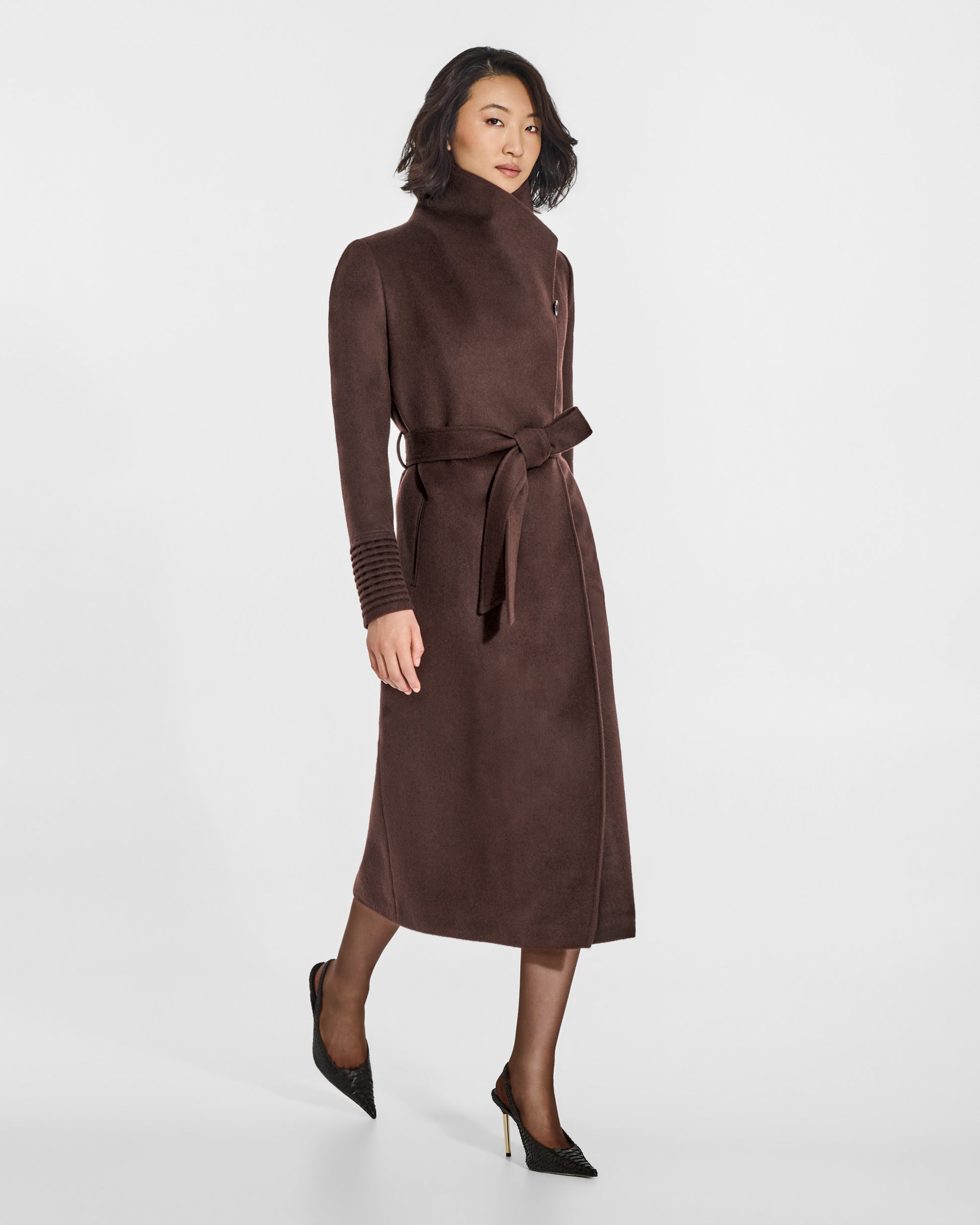 SENTALER Long Funnel Collar Wrap Coat in Chocolate Brown, Baby Alpaca. Worn by a female model, side view, belted.
