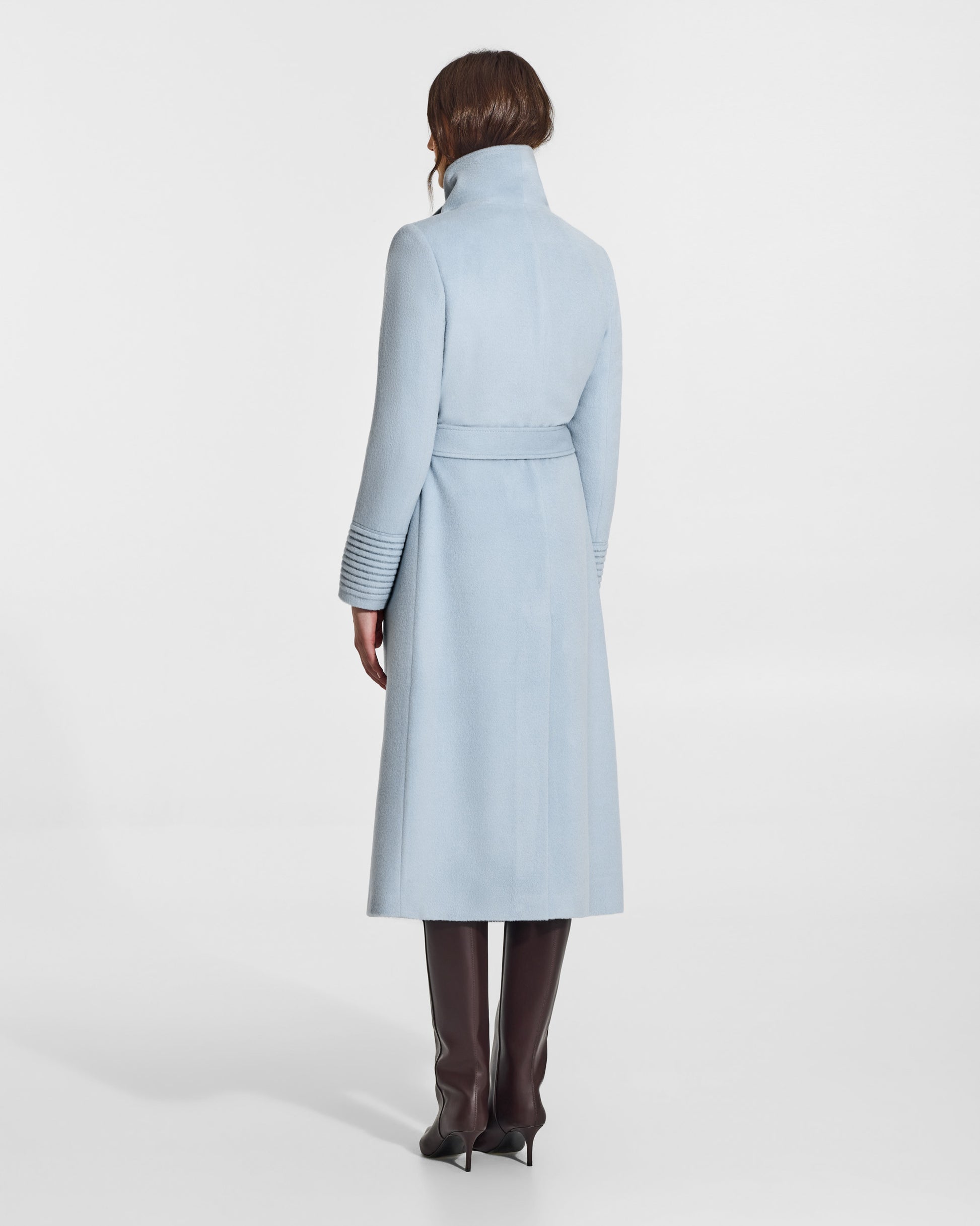 SENTALER Long Funnel Collar Wrap Coat in Glacial Blue, Baby Alpaca. Worn by a female model, back view, belted.