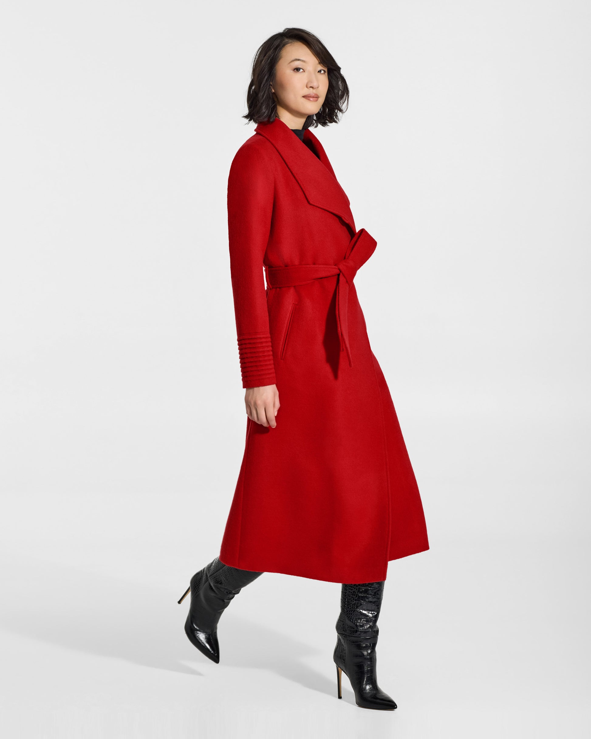 SENTALER Long Funnel Collar Wrap Coat in Scarlet Red, Baby Alpaca. Worn by a female model, side view, belted.