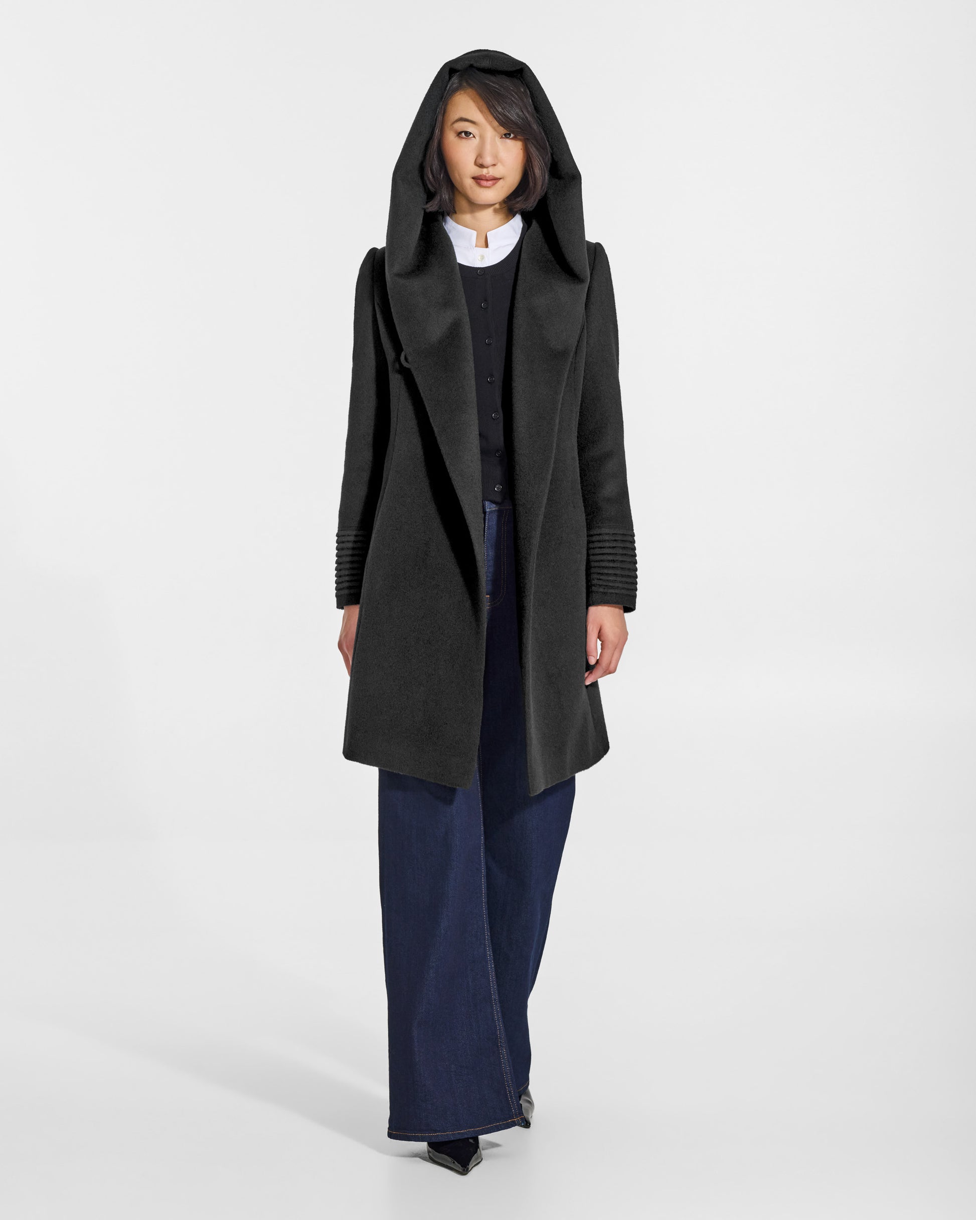 SENTALER Mid Length Hooded Wrap Coat in Black, Baby Alpaca. Worn by a female model, front view, open.