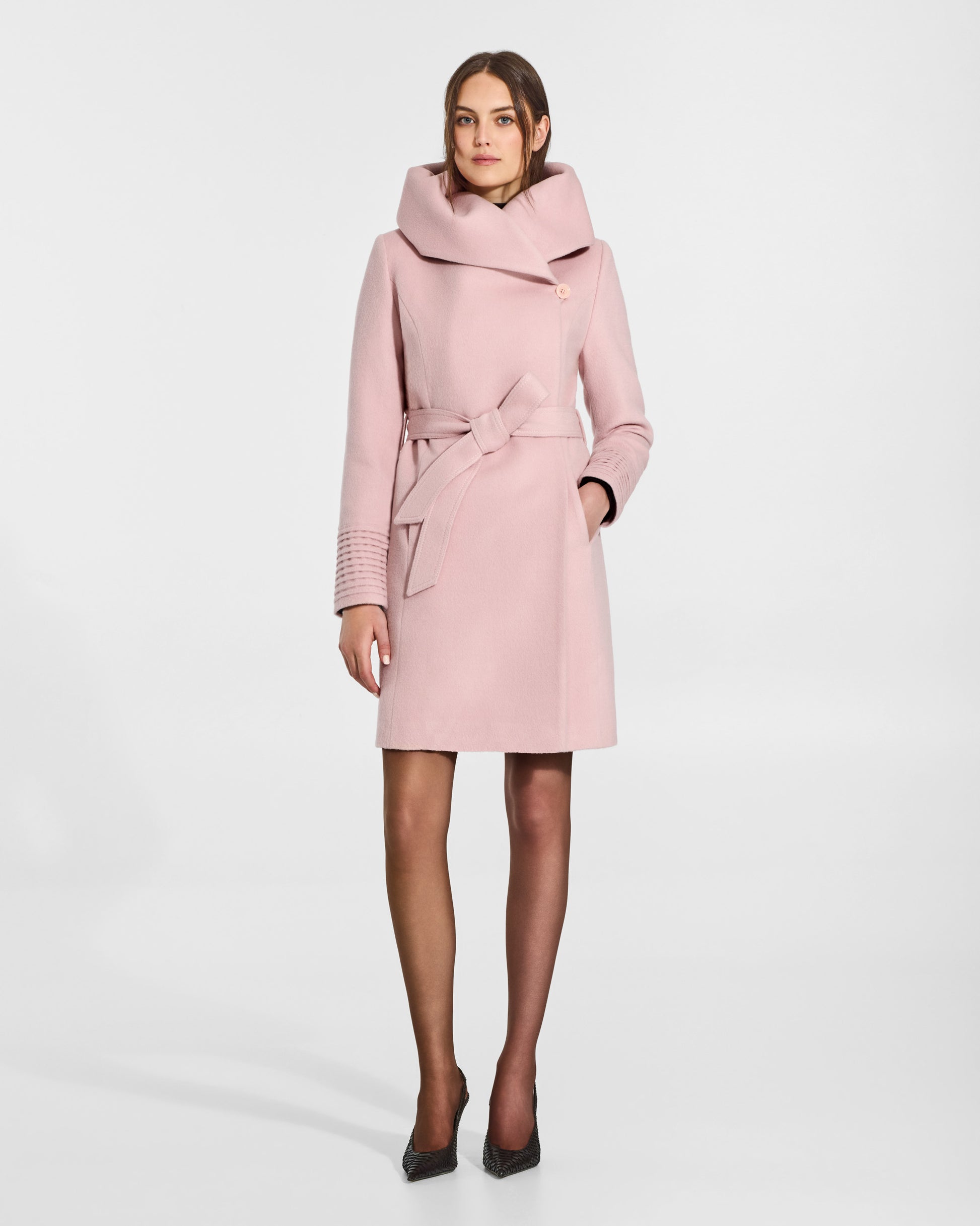 SENTALER Mid Length Hooded Wrap Coat in Pink Frost, Baby Alpaca. Worn by a female model, front view, belted with cowl neck.