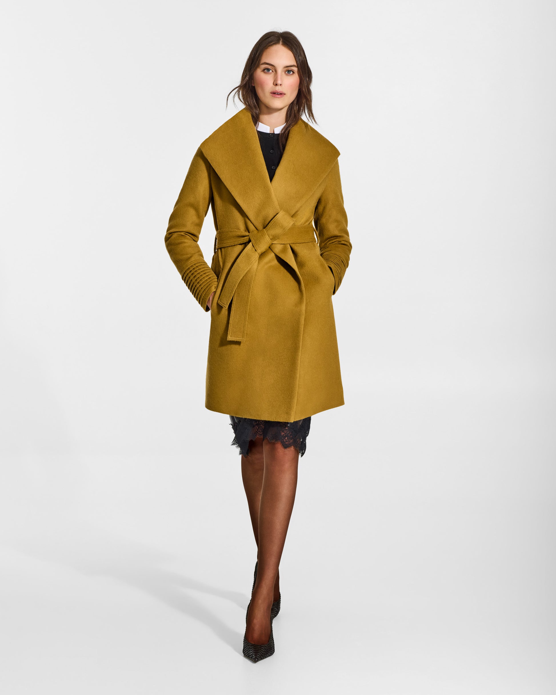 SENTALER Mid Length Shawl Collar Wrap Coat in Amber Haze, Baby Alpaca. Worn by a female model, front view, belted.