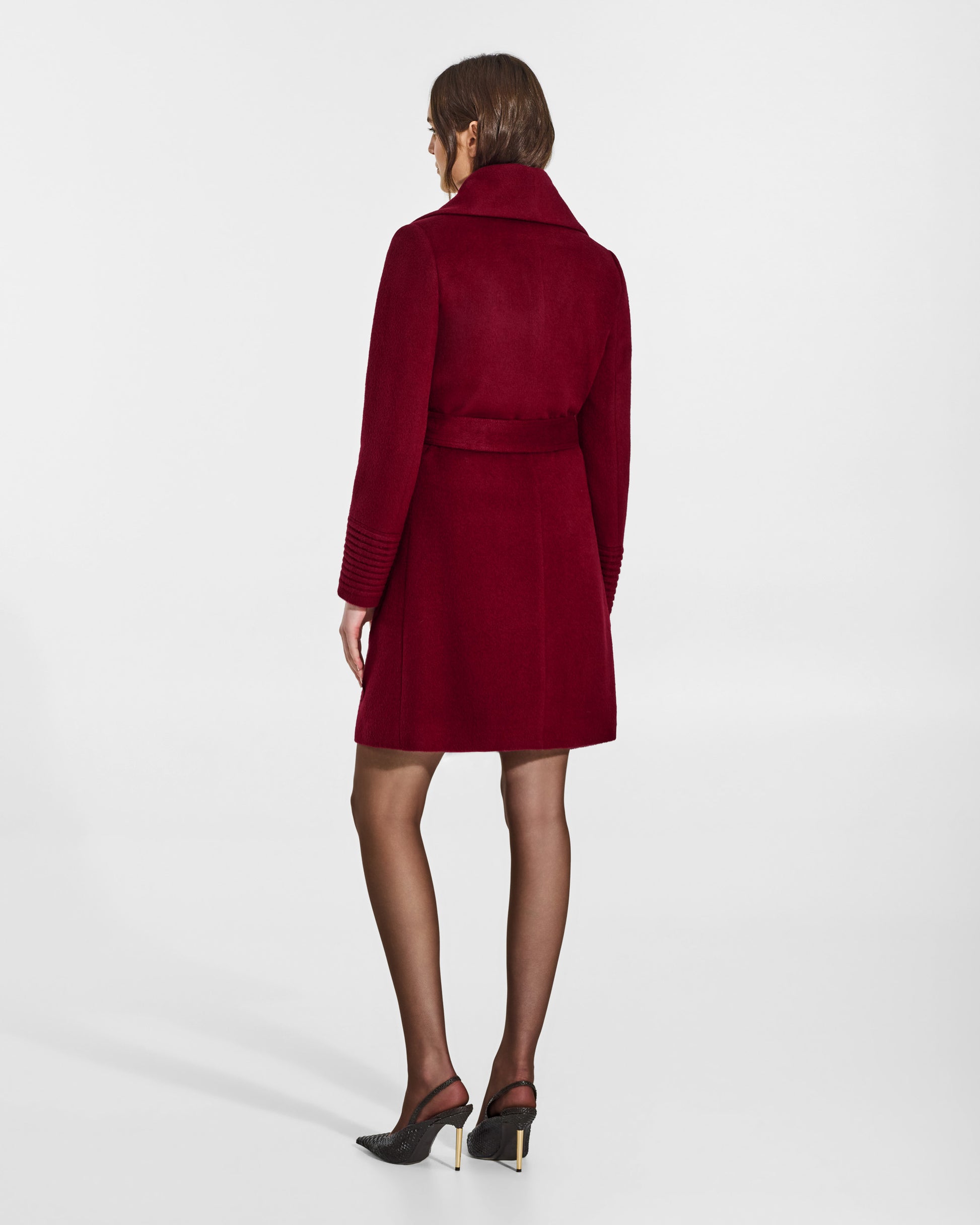 SENTALER Mid Length Shawl Collar Wrap Coat in Garnet Red, Baby Alpaca. Worn by a female model, back view, belted.