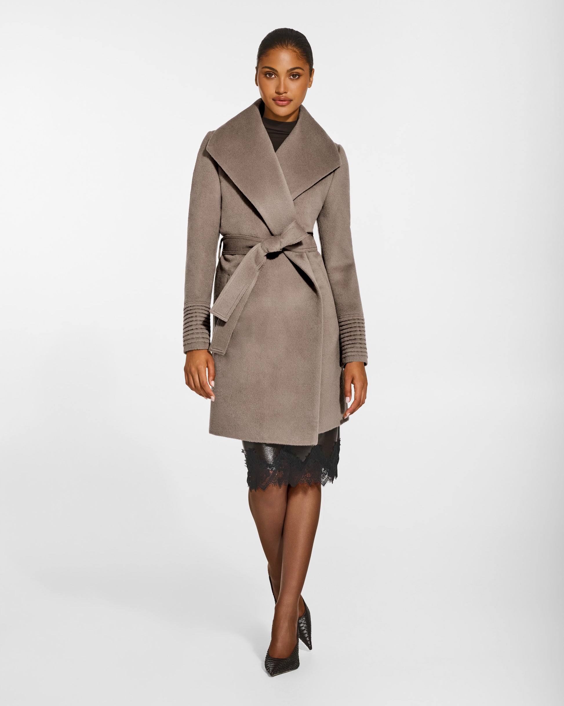 SENTALER Mid Length Shawl Collar Wrap Coat in Warm Taupe, Baby Alpaca. Worn by a female model, front view, belted.