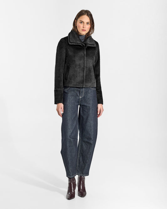 SENTALER Moto Jacket with Signature Double Collar in Black, Bouclé Alpaca. Worn by a female model, side view, buttoned.