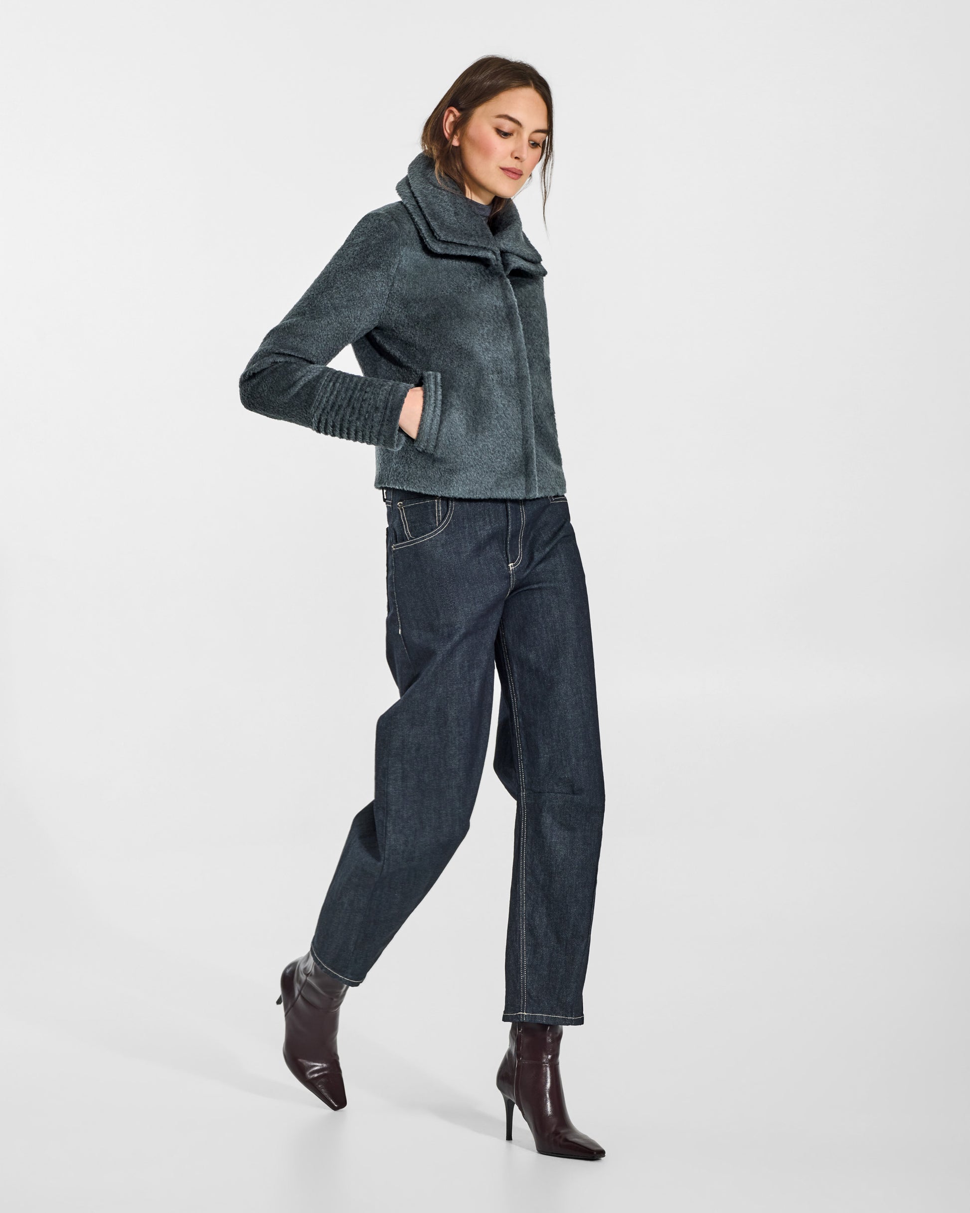 SENTALER Moto Jacket with Signature Double Collar in Graphite, Bouclé Alpaca. Worn by a female model, side view, buttoned.