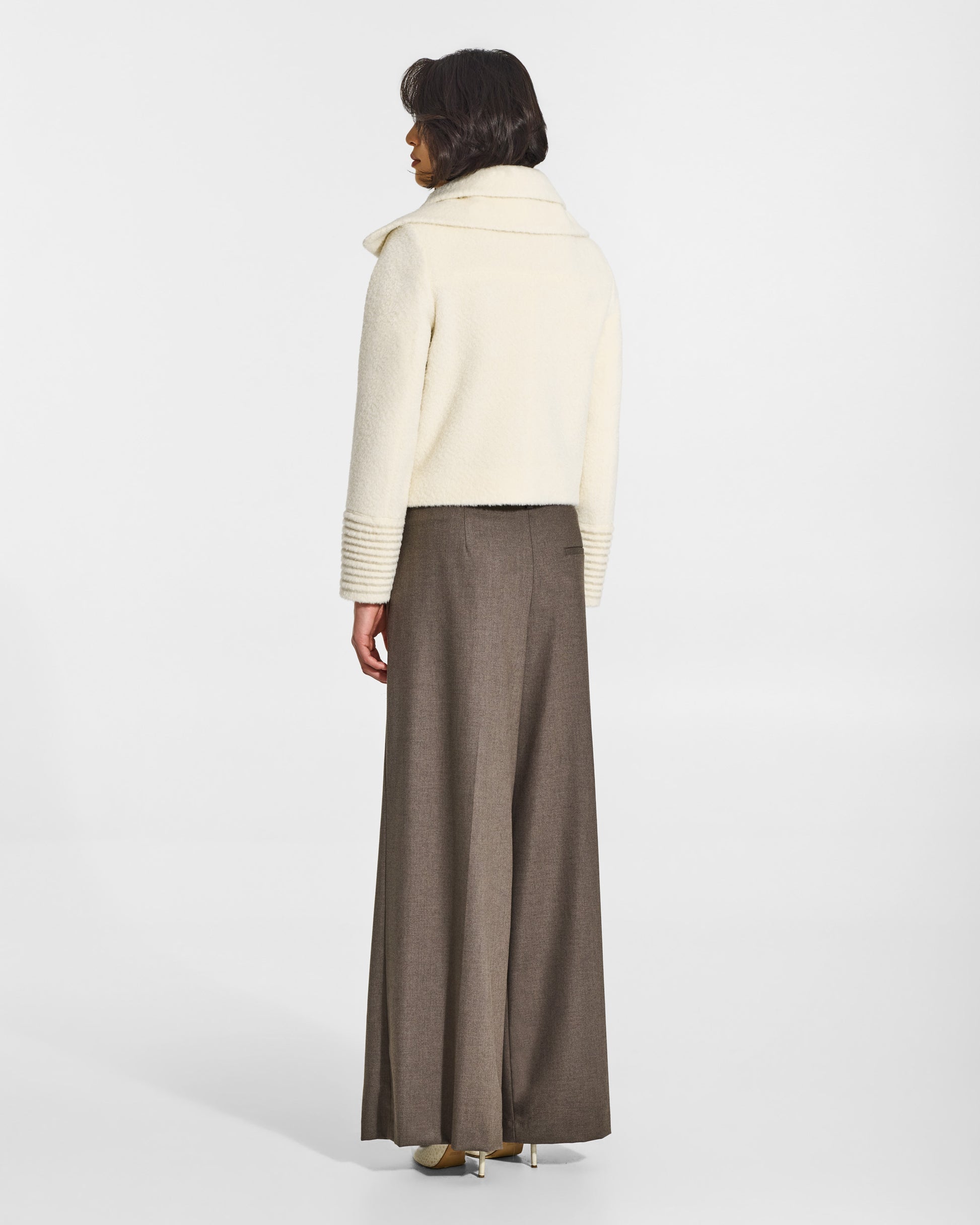 SENTALER Moto Jacket with Signature Double Collar in Ivory, Bouclé Alpaca. Worn by a female model, back view, buttoned.