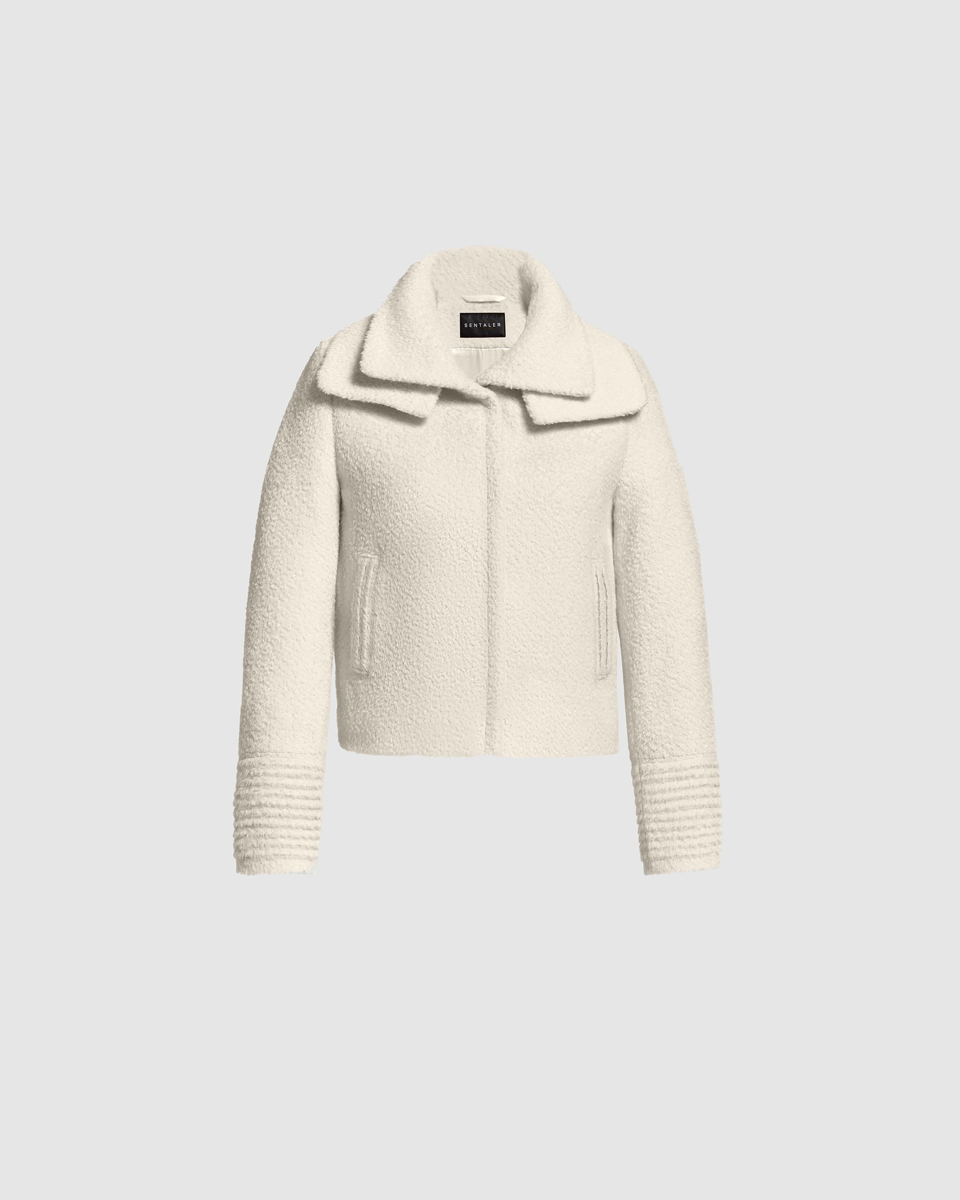 SENTALER Moto Jacket with Signature Double Collar in Ivory, Bouclé Alpaca. Off-figure, belted.