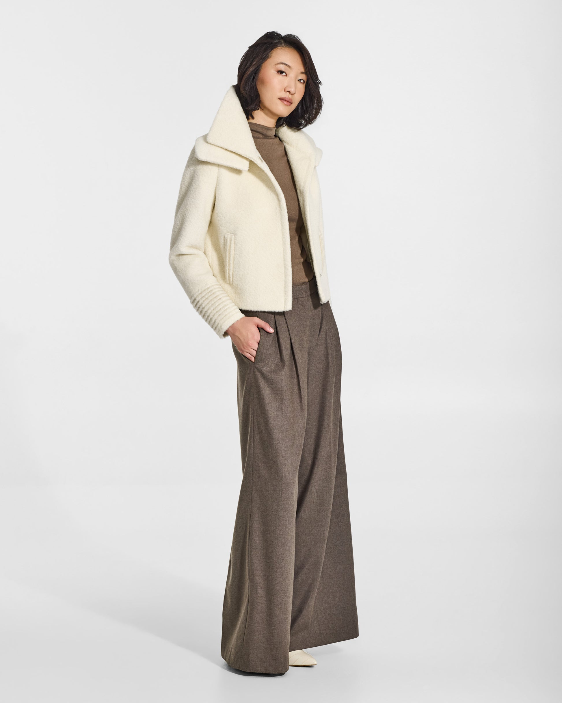 SENTALER Moto Jacket with Signature Double Collar in Ivory, Bouclé Alpaca. Worn by a female model, side view, open.