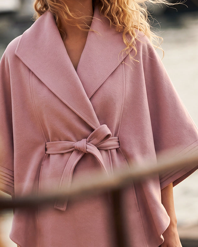 SENTALER Cape with Shawl Collar and Belt in Pink Frost, Baby Alpaca — worn by a female model, front view, close up, belted.