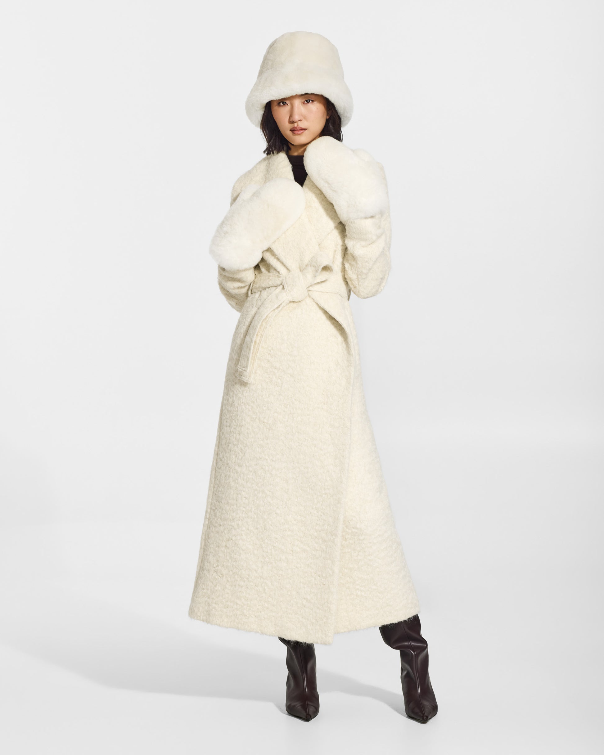 SENTALER Oversized Shearing Mittens in Ivory, Alpaca Shearling. Worn by a female model, front view.