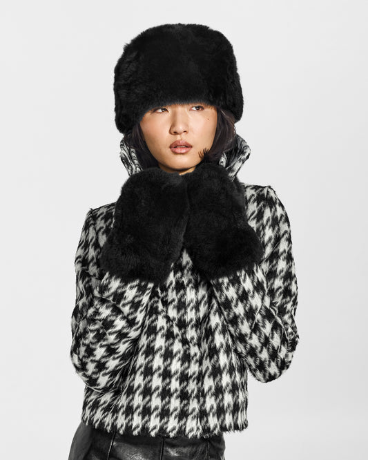 SENTALER Oversized Shearing Mittens in Black, Alpaca Shearling. Worn by a female model, front view, close-up.