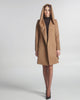 SENTALER Mid Length Hooded Wrap Coat in Dark Camel, Baby Alpaca. Product video, worn by a female model, full-length and detail views of the fabric and finishing.