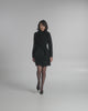 SENTALER Mid Length Shawl Collar Wrap Coat in Black, Baby Alpaca. Product video, worn by a female model, full-length and detail views of the fabric and finishing.