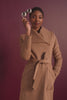 Sentaler camel long wrap coat made of baby alpaca wool with a wide collar, on female model.
