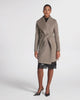 SENTALER Mid Length Shawl Collar Wrap Coat in Warm Taupe, Baby Alpaca. Product video, worn by a female model, full-length and detail views of the fabric and finishing.