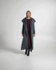 Video of model wearing a Sentaler maxi graphite coat made of suri alpaca wool, with a hooded collar.
