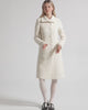 Video of model wearing a Sentaler ivory glittered A-line coat made of tweed suri alpaca wool.