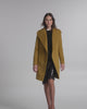 SENTALER Mid Length Shawl Collar Wrap Coat in Amber Haze, Baby Alpaca. Product video, worn by a female model, full-length and detail views of the fabric and finishing.
