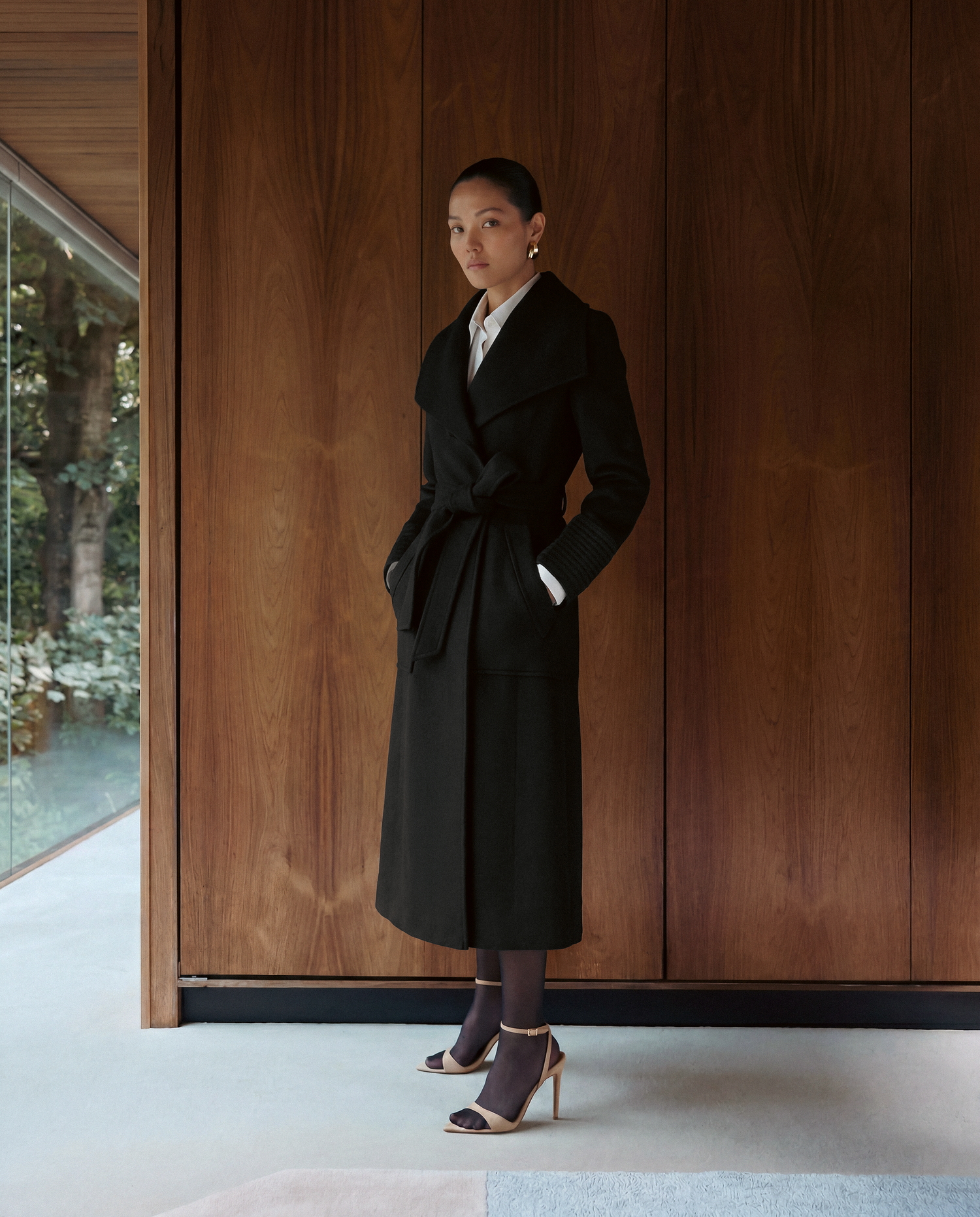 SENTALER Long Wide Collar Wrap Coat in Black, Baby Alpaca — worn by a female model, front view, belted.