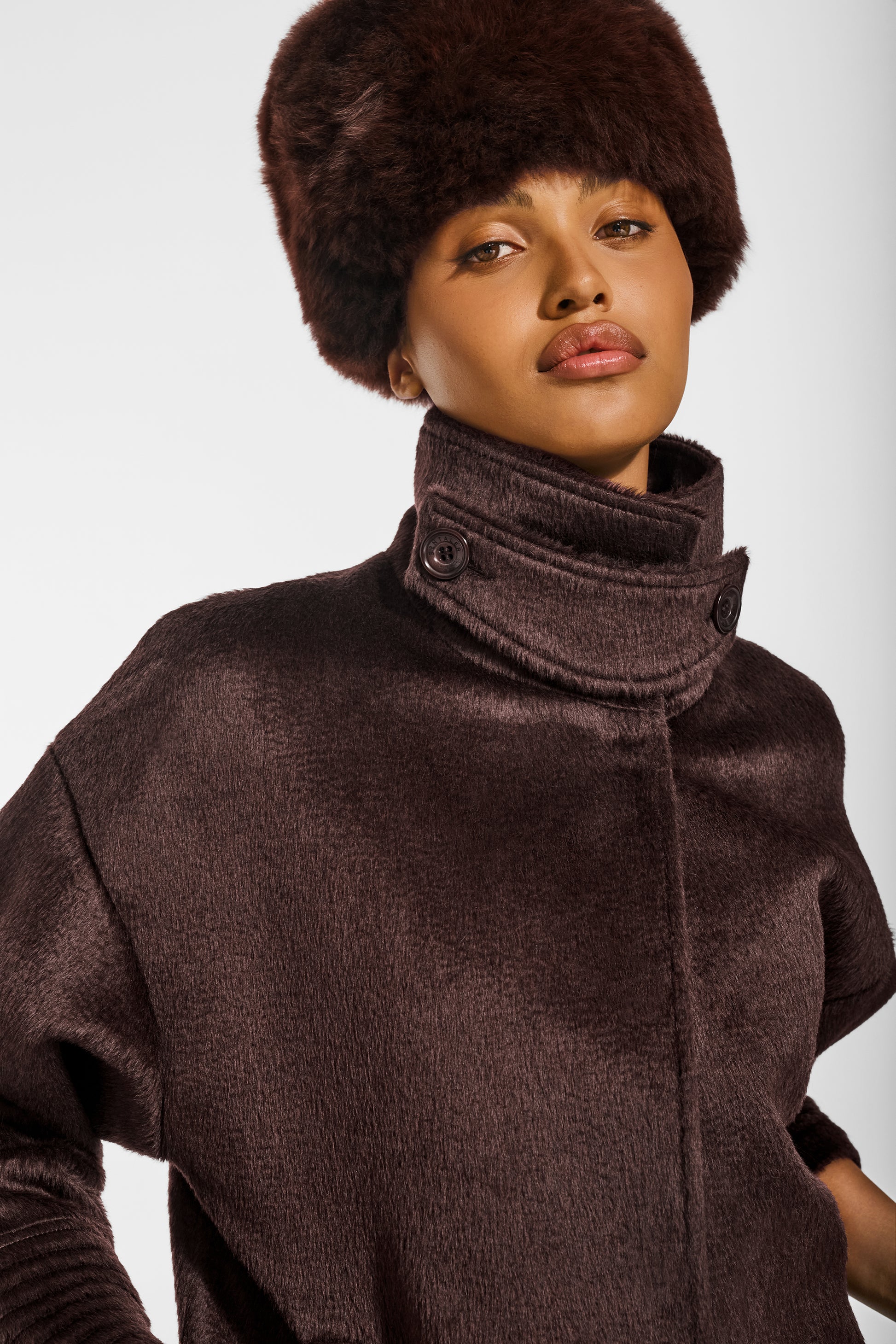 SENTALER Shearling Hat in Chocolate Brown, Alpaca Shearling. Worn by a female model, front view, close-up.
