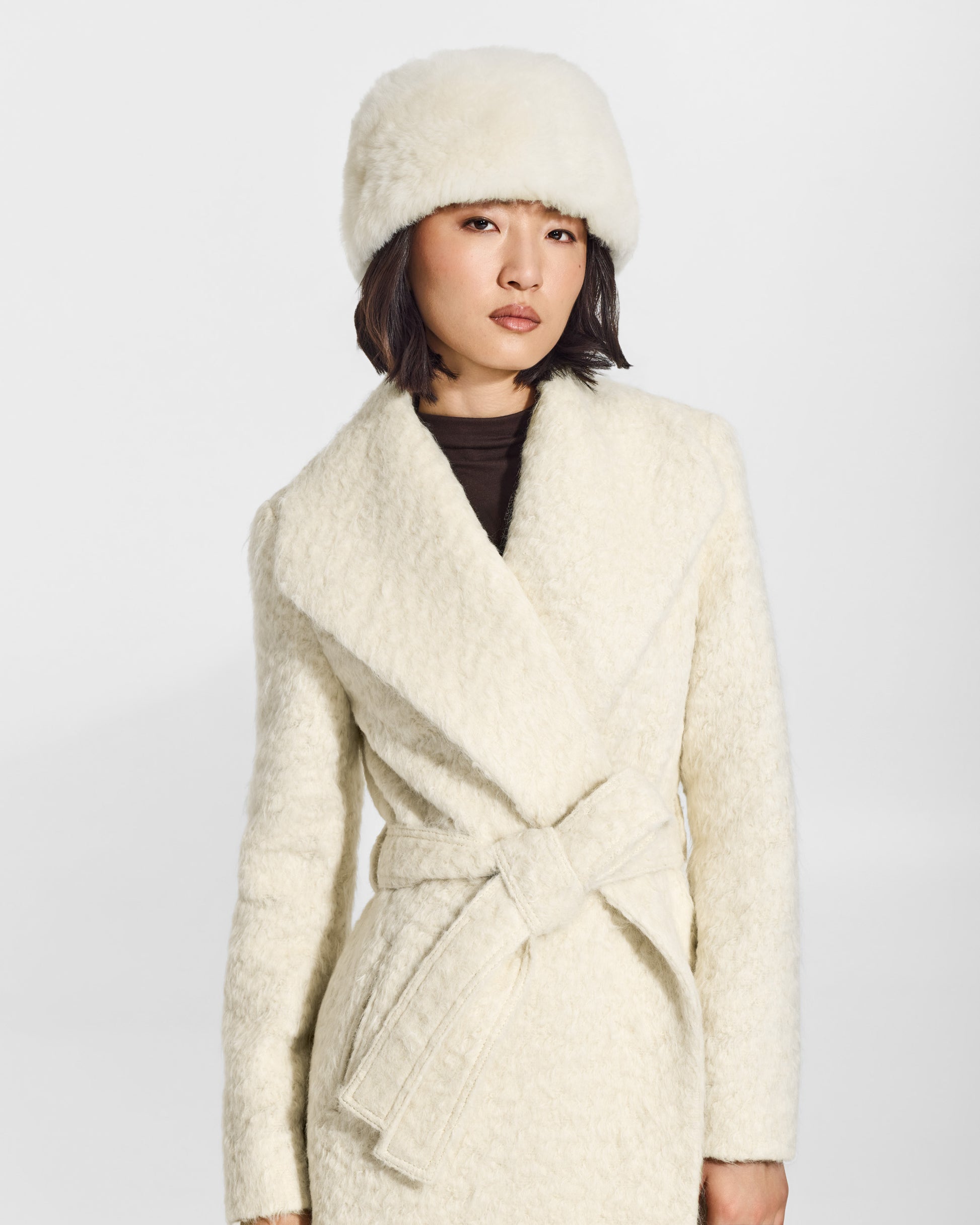 SENTALER Shearling Hat in Ivory, Alpaca Shearling. Worn by a female model, front view.