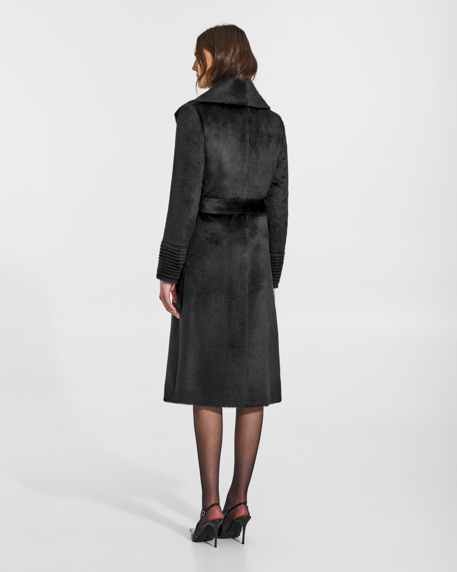 SENTALER Long Shawl Collar Wrap Coat in Black, Suri Alpaca. Worn by a female model, back view, belted.