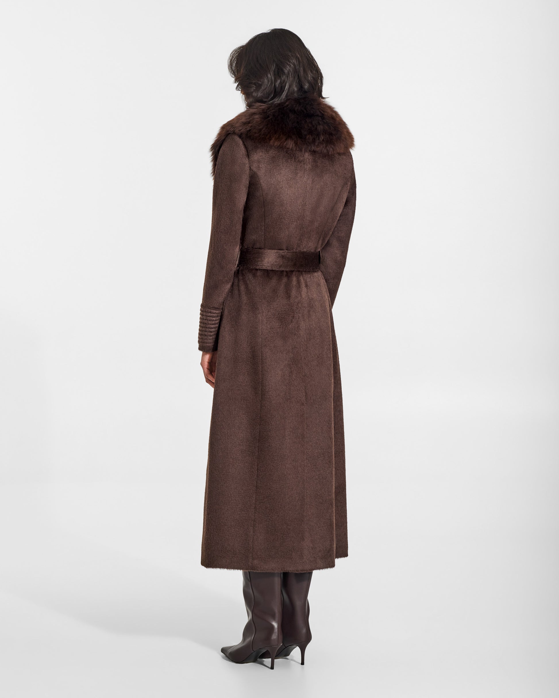 SENTALER Maxi Coat with Alpaca Shearling Collar in Chocolate Brown, Suri Alpaca. Worn by a female model, back view, belted.