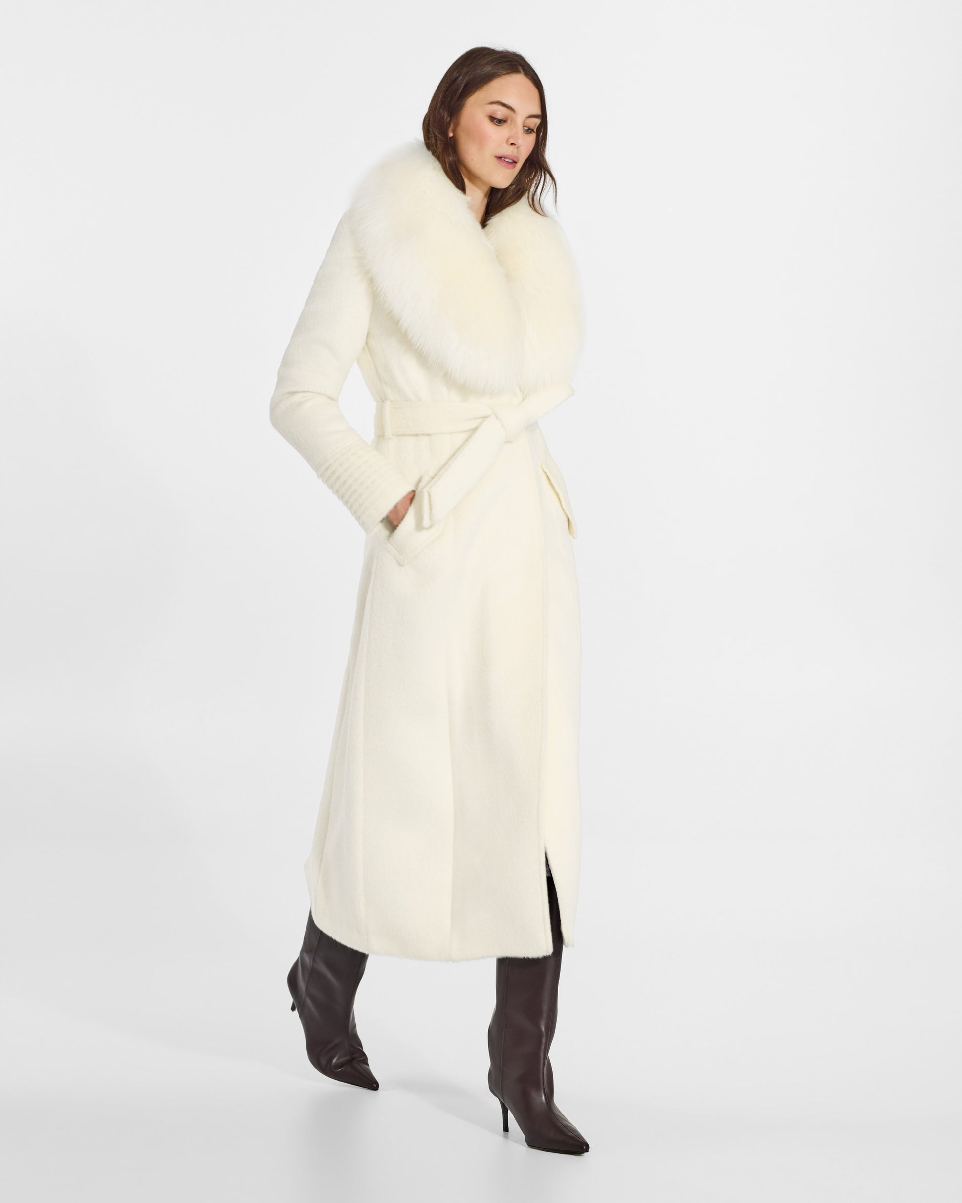 SENTALER Maxi Coat with Alpaca Shearling Collar in Ivory, Suri Alpaca. Worn by a female model, side view, belted.