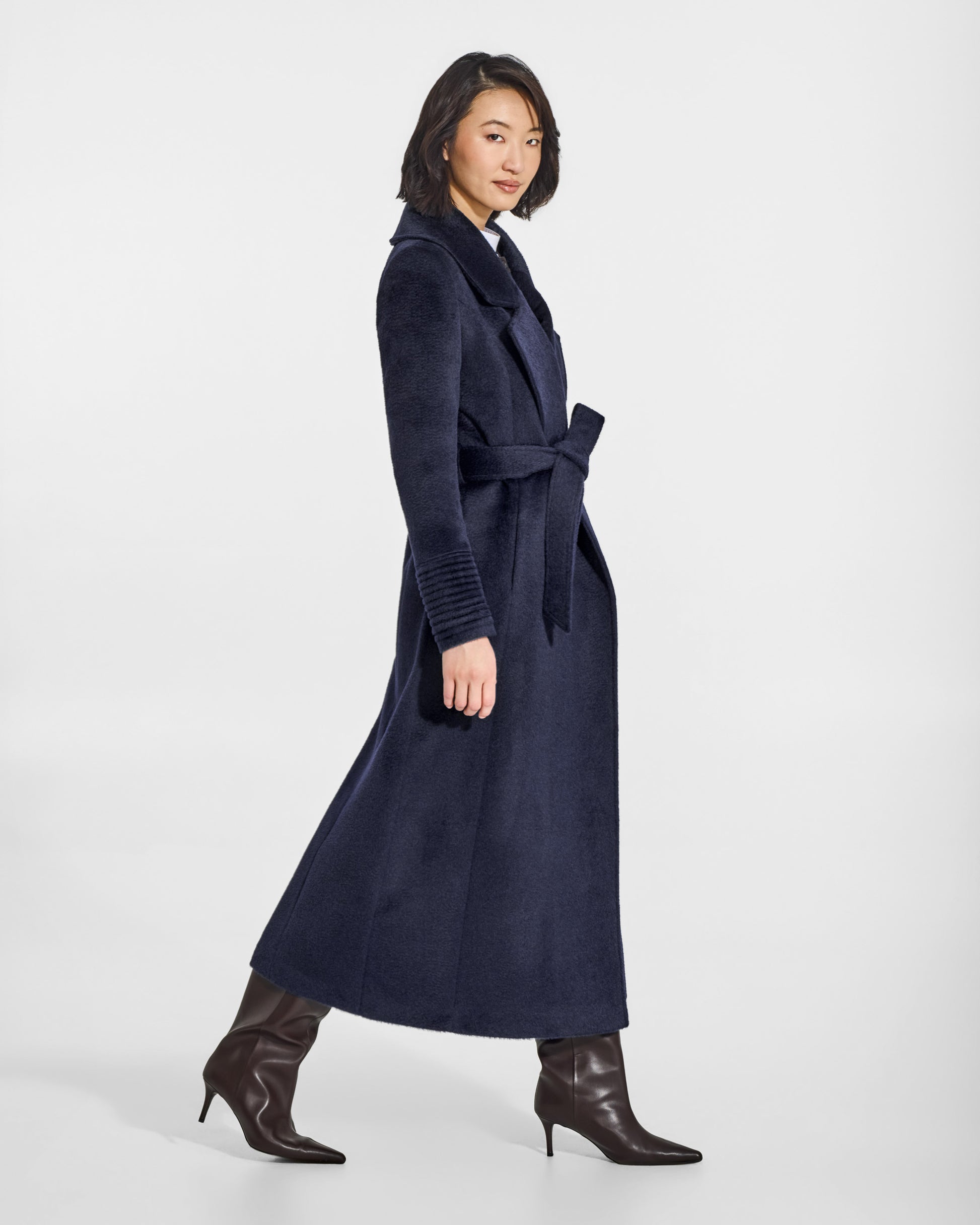 SENTALER Maxi Notched Collar Wrap Coat in Deep Navy, Suri Alpaca. Worn by a female model, side view, belted.