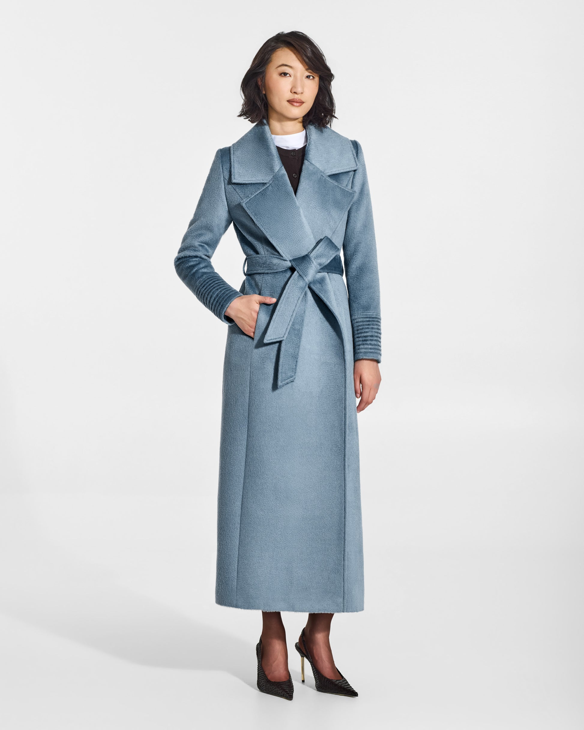 SENTALER Maxi Notched Collar Wrap Coat in Steel Blue, Suri Alpaca. Worn by a female model, front view, belted.